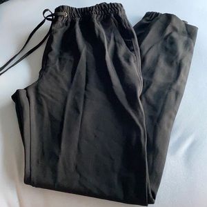 Black drawstring jogger style trousers w/ pockets